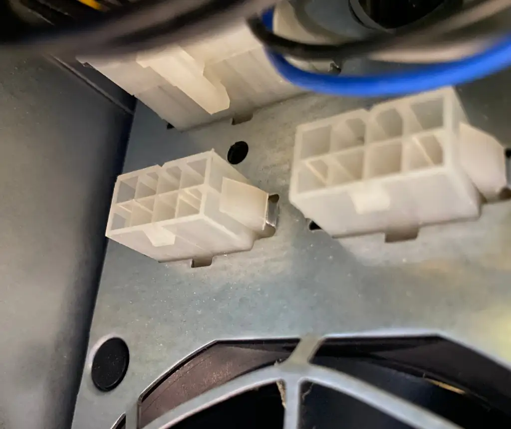 Two 12V power connectors exposed on the unit's power supply.